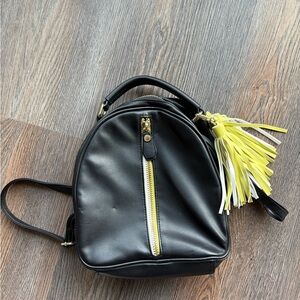 Small Steve Madden Black Backpack with Yellow Tassel Accent